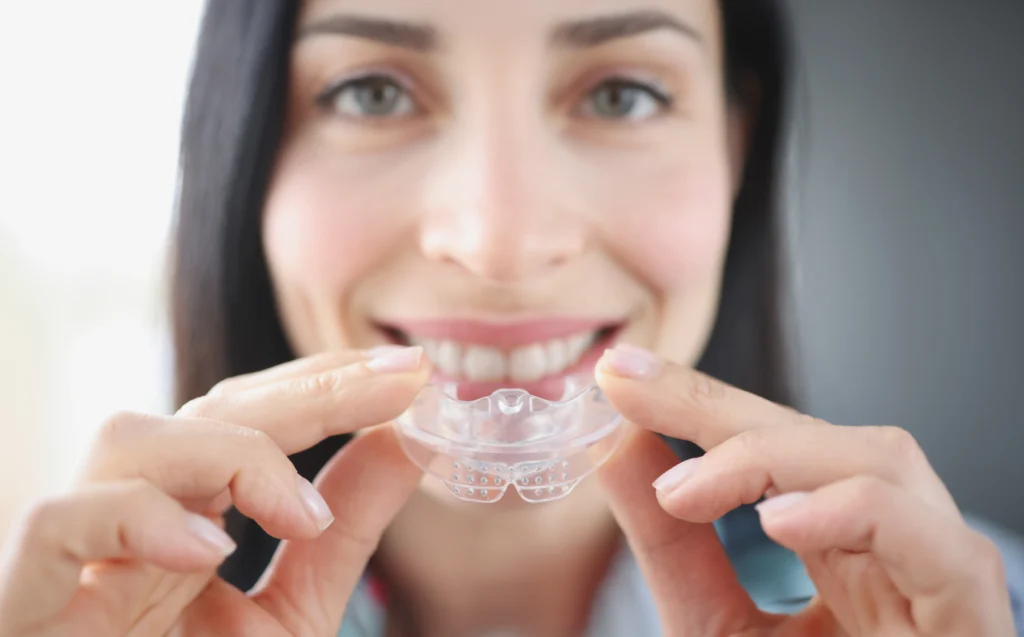 Night guard to prevent teeth grinding that causes tooth pain and enamel damage during sleep.