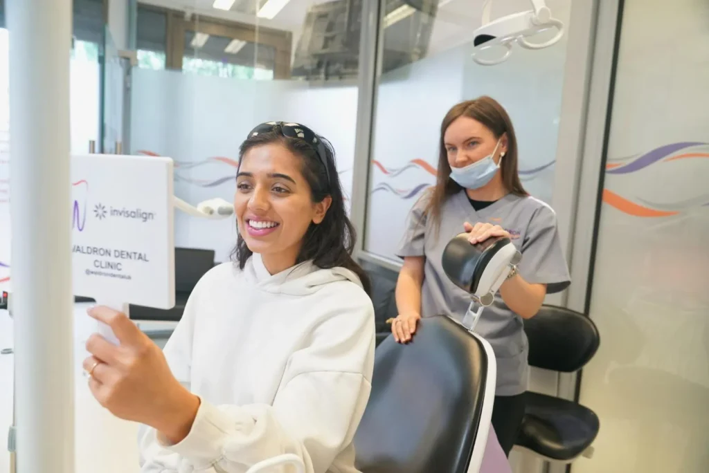 Waldron Dental patient learning if Invisalign or lingual braces provide faster results during consultation.